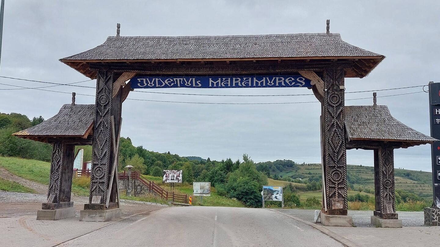 Welcome to Maramures; wooden gate structures are traditional entry points to villages etc