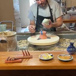 Adjusting a clay ornament