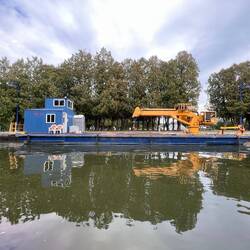 Canal work barge sitting at the approach end of lock 2