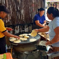 The restaurant's tortilla makers work outside.