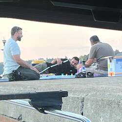 How come the guy laying down gets the long hose? (Shot from our cabin)