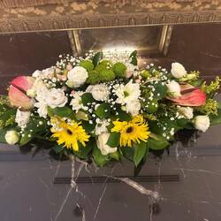 Coffee table arrangement of flowers in the lobby