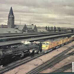 Two locomotives beside the Cheyenne depot platform canopies