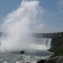 The mist of Niagara Falls climbs high into the sky