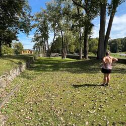 Rosanne standing in Schoharie Crossing looking at the Yankee Hill locks