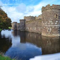 Beaumaris castle. Building started in the late 1200 by Edward I of England after he conquered Wales.