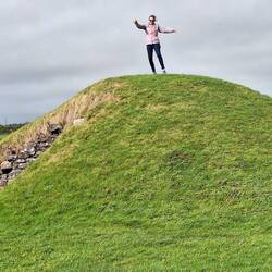 Jules doing a dance of delight at the Bryn Celli Ddu burial mounds 2000BC.