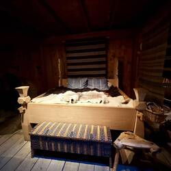Bed belonging to wealthy, short woman