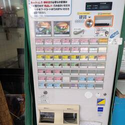 At a cafe you put in money, press your choice then give the docket to the barrista!