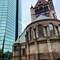 Old church next to ultra modern glass walled building