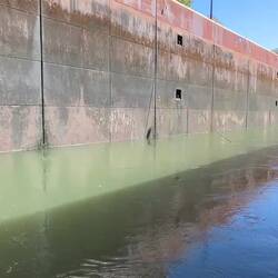 Notice the water flow across the lock. The north wall lock lines are being pulled out with the flow.
