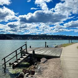 Cycling along the sapphire coast, with its multiple shades of blue water, arriving into Merimbula
