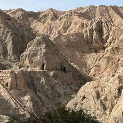 Arid hills bored with Buddhist meditation caves