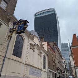New contemporary building towing over the old buildings