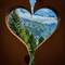 I get creative framing the scenery through a heart carved into our balcony railing — Mürren.