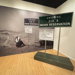 A Native American Photographer took self portraits with his signs in various plavces.