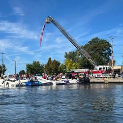 That's the American Flag hanging from the firetruck ladder. Guess the breeze turned it...