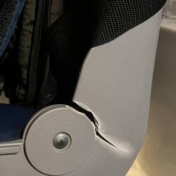 I have to stop pushing back in my chair. The crack is at the top of the hinge