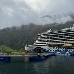 A massive cruise ship was docked in the harbor