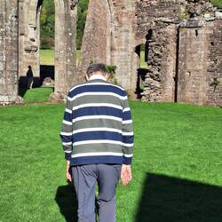 Geoff, tired after a long walk, being made to look at the priory ruins again.