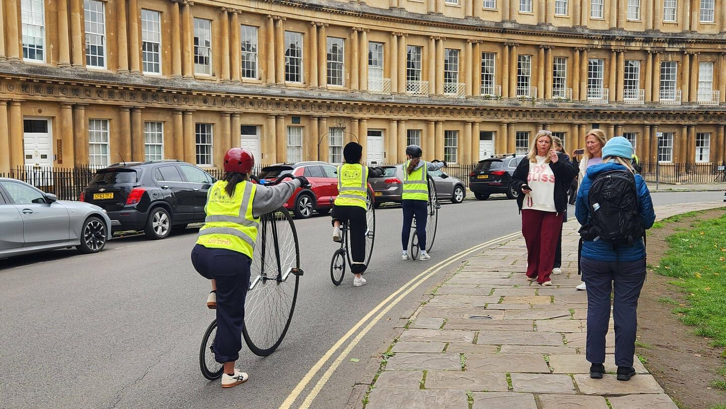 Yes, this group is learning to ride real penny farthings!