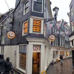 Cheese shop that wrapped around the corner, all windows showing cheese.