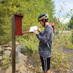 Signing the trail journal