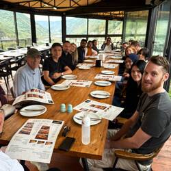 At the table from Holland, England, Italy, India, Poland, other travelers enjoying Georgian cuisine