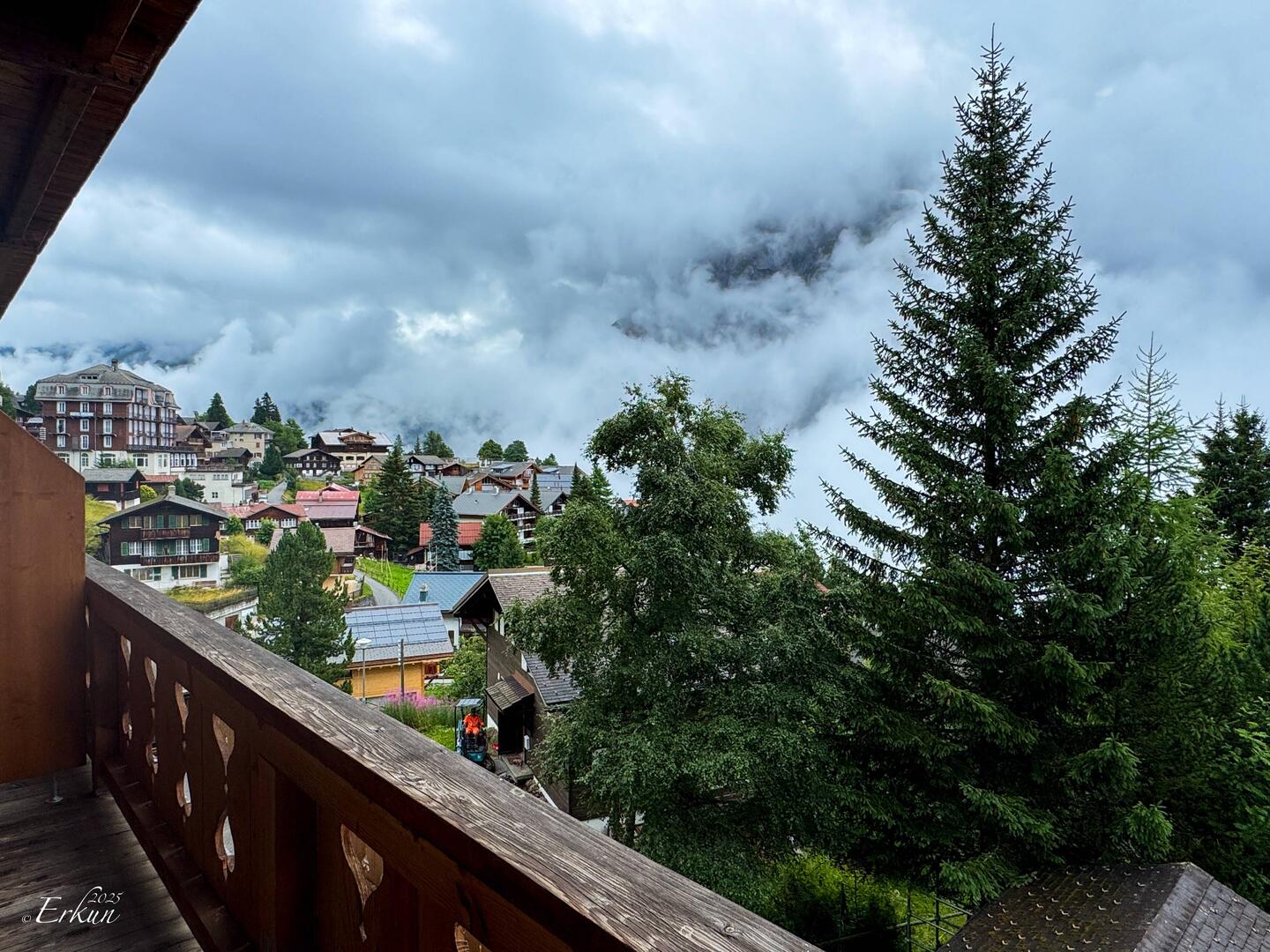 By 8:00a, the white wall of clouds began clearing, allowing us to see the village — Mürren.