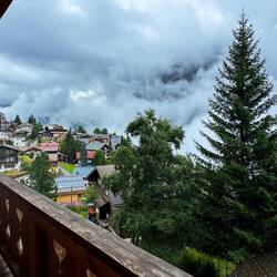 By 8:00a, the white wall of clouds began clearing, allowing us to see the village — Mürren.