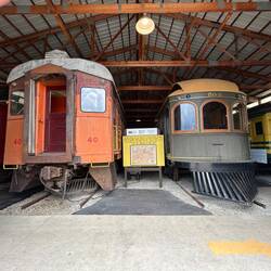 A caboose and some Interurban trolleys in one of the IRM carbarns