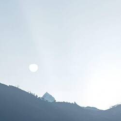 Having coffee in Caraz at 6:27, an optical illusion of the sun and a sharp mountain in sight!
