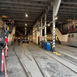 Passengers disembark to collect their vehicles from the carpark