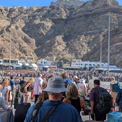 Trying to get off the ferry with a few other travelers. Look at the cliffs we have to get over.