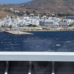Arriving at one of the islands to drop off and pick up passengers.
