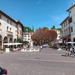 The main square in Asolo, Italy. Scores of bicyclists in town on this Sunday