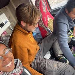 The trucker is a bit embarrassed about the chaos in his cabin but happy to have some guests