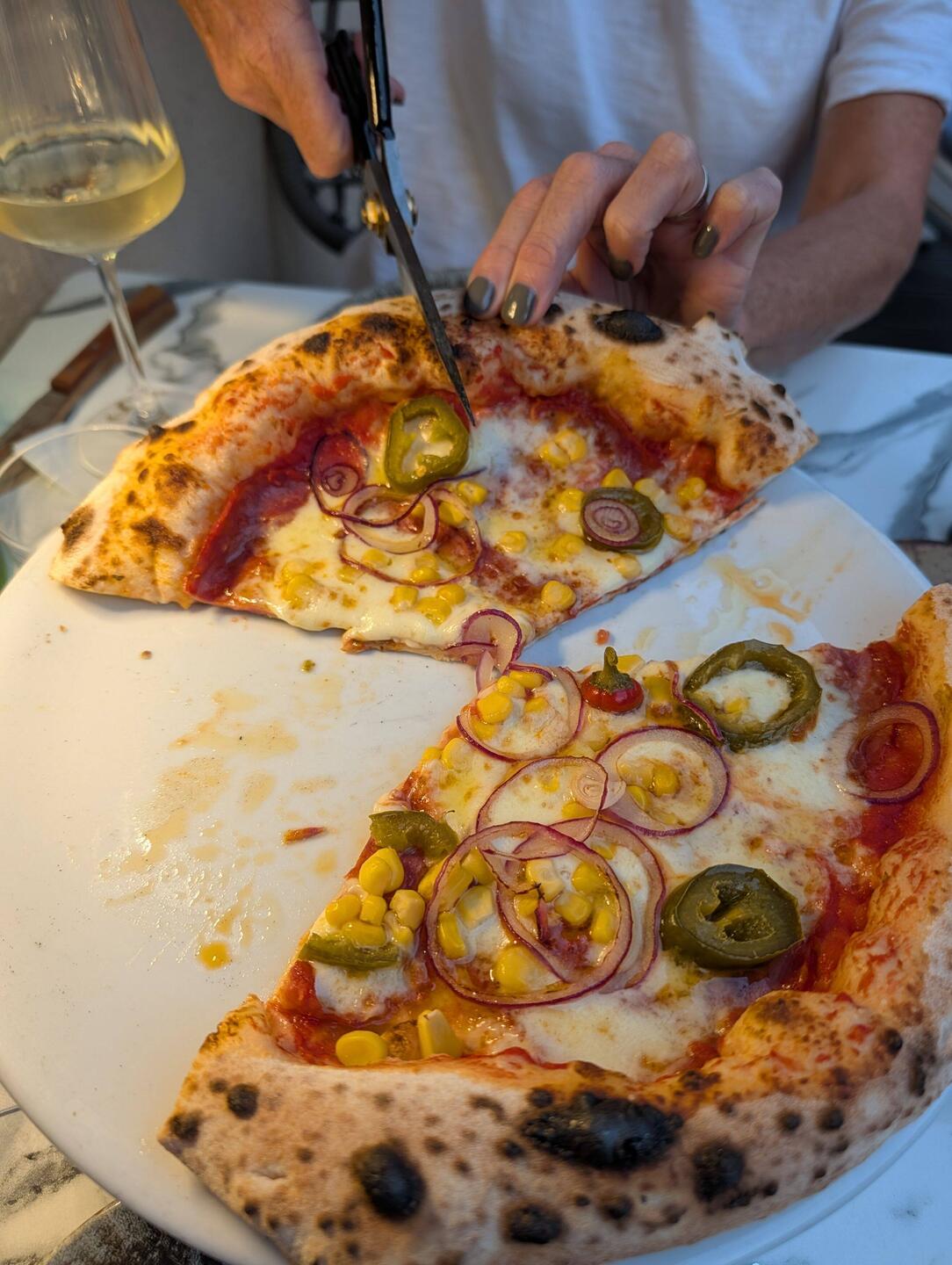 Pizza scissors and Yes that's corn on the pizza.