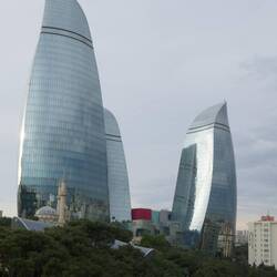 The Flame Towers dwarf the large adjacent mosque