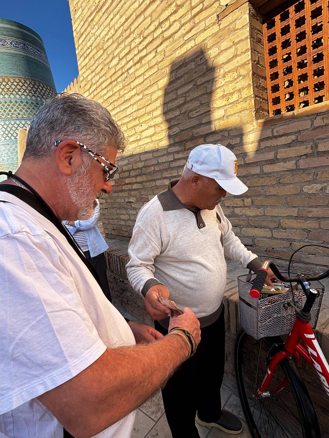 Brad exchanging money. Dealing out of a bicycle basket.🤔