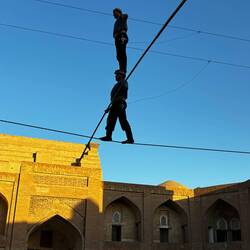 One brother balancing on the other's head