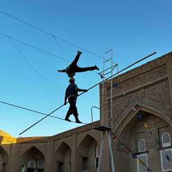 One arm on his brother's head