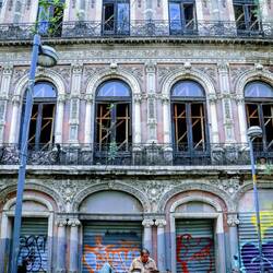 Beautiful abandoned building and a singer with a bagpipe.