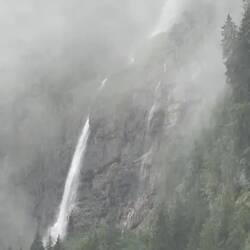 Waterfall through the heavy downpour — Kandersteg, Switzerland.