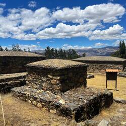 The material covering the roof (thatch, tiles...) is unknown, but the support structure was stone