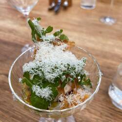 Burrata with Parmesan olive oil purple olives and cantaloupe