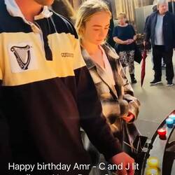 Charlie and Jaimee light candles for Amr in France