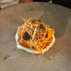 Gin soaked trout with melon and fried onions