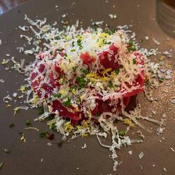 Beef carpaccio with roasted bell peppers and Parmesan
