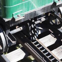 The rear cog on the engine and the rack